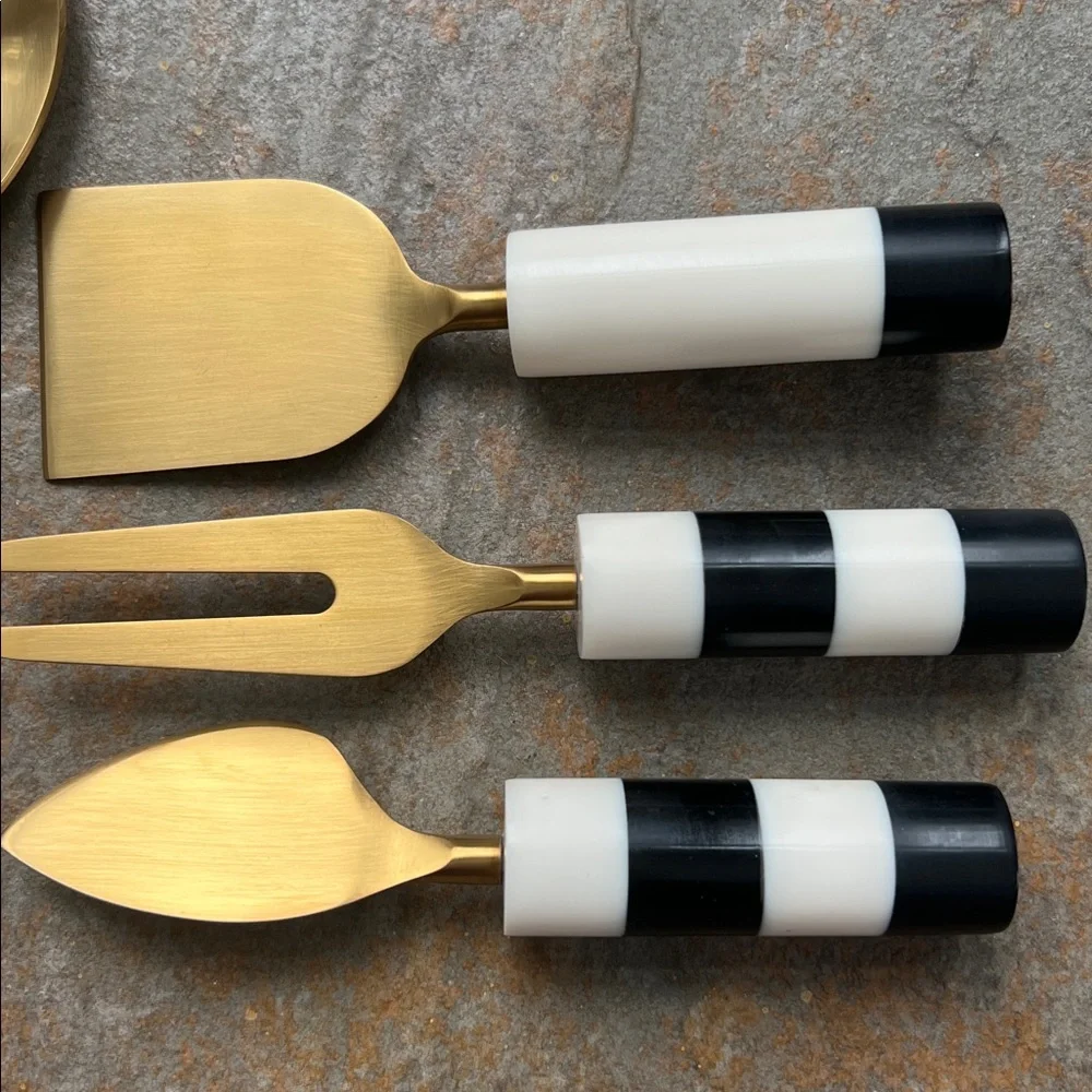NWOT Gold colored metal Black and white Striped Flatware serving Set